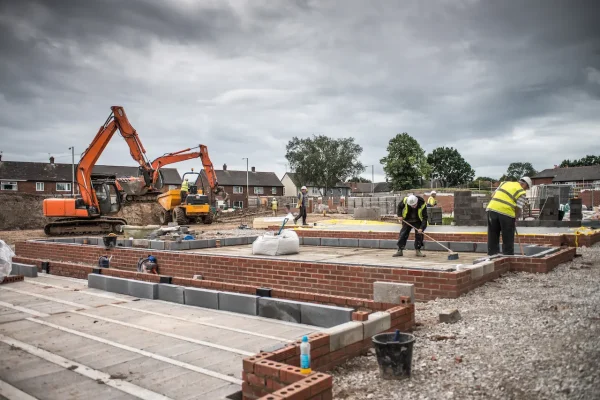 workers-laying-bricks-on-construction-site-2026-01-05-06-22-53-utc